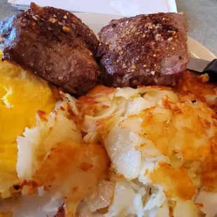 Sirloin steak, eggs, and potatoes