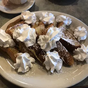 French toast with icing and whip cream.