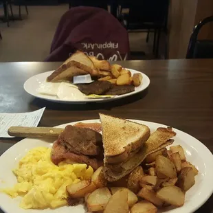 two plates of breakfast food