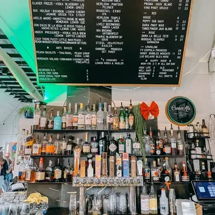 a bar with a menu on the wall