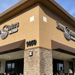 Four sisters outside corner view