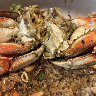crab legs and rice in a bowl