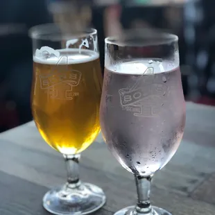 two glasses of beer on a table