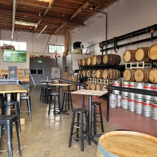 barrels and tables in a brewery