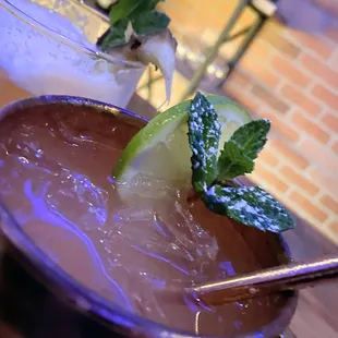 two cocktails on a table