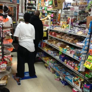two people shopping in a grocery store