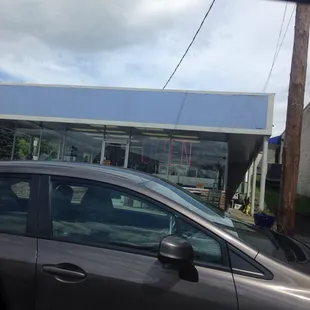 a car parked in front of a restaurant