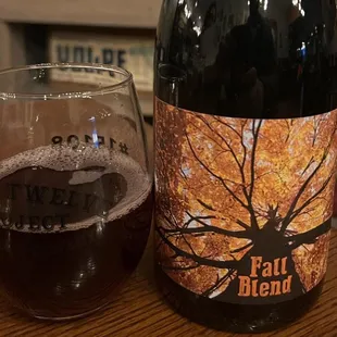 a glass and a bottle of beer