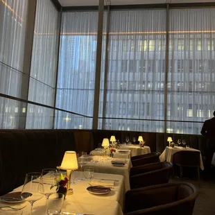 a dining room with a view of the city