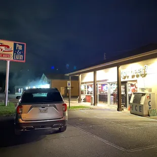 a car parked in front of a restaurant