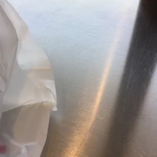 a sandwich wrapped in a plastic bag