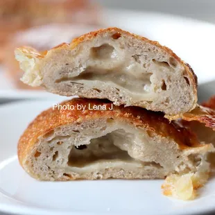 Inside of Cheese Roll ($4.25) - Levain dough with Gruyère cheese, Manchego cheese, &amp; cubeb pepper. Delicious. Chewy bread, very cheesey.