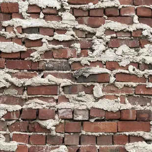 Check out the cool brick work on the buildings wall outside