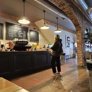 a woman standing at the counter