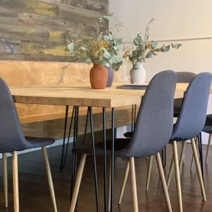 a wooden table and chairs