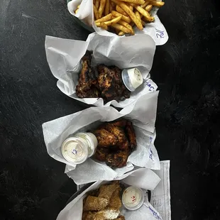 Top to Bottom-fries, Carribean Jerk, Tough Guy, &amp; Spicy Butter Garlic Parmesan!