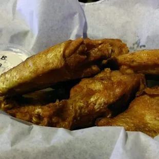 The Louisiana hot sauce wings are not sauced after cooking and are naked.