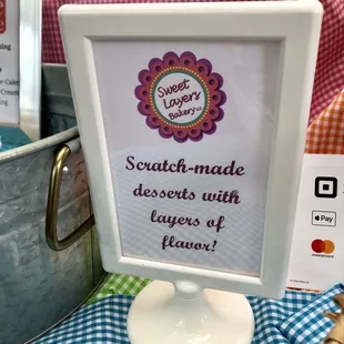 a sign that says scratch - made desserts with layers of flavor