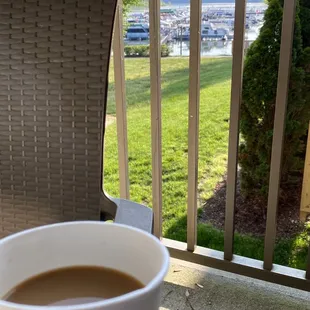Coffee on the porch. The in-room coffee tastes better than the complementary coffee in the lobby.