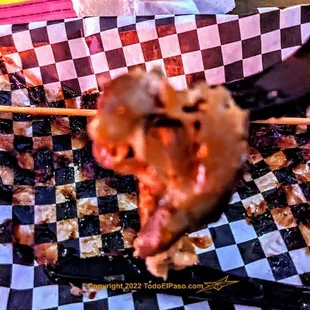 Inedible pork skewer