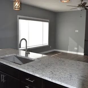 a kitchen with granite countertops