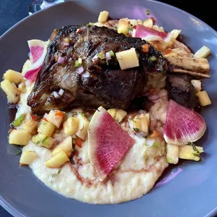 Lamb shank with cheesy grits, watermelon radish and pineapple
