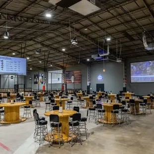 tables and chairs in a large warehouse