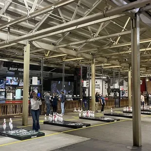 people standing in a warehouse