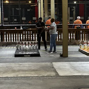 a group of people standing in a warehouse