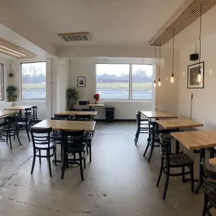 a dining room with tables and chairs