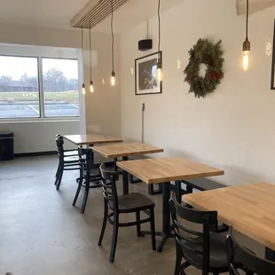a dining area with tables and chairs