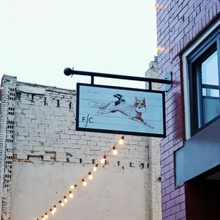 a brick building with string lights