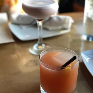 a drink in a glass on a table