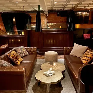 a living room with leather furniture