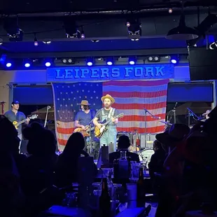 a band performing on stage