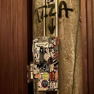 a telephone with graffiti on it