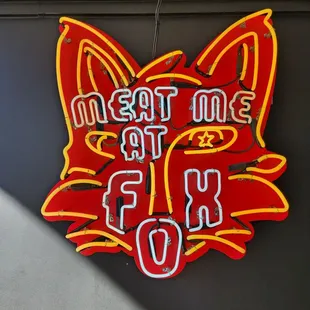 a neon sign for a restaurant