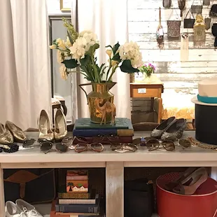 vintage sunnies, shoes, and a wall of antique purses.