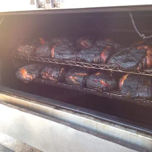 Our cooker loaded with pork butts for a catering event