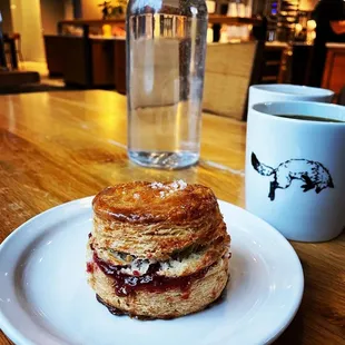 a pastry and a cup of coffee