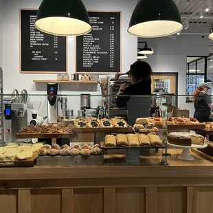 a bakery counter full of pastries