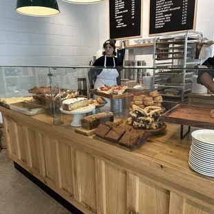 a bakery counter full of baked goods