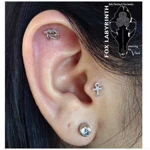 Fresh helix and tragus with 14k white gold Eye of Horus and 14k white gold Anhk.