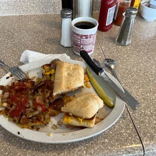 Strip steak samwich with potatoes including grilled onions