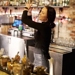 a woman pouring a glass of wine