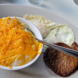 a plate of food with eggs and hash browns