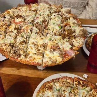 Fox Ridge Special Sausage, Pepperoni, Smoked Sausage, Canadian Bacon, BBQ Pork, Onion, Bell pepper and Mushrooms 16 inch