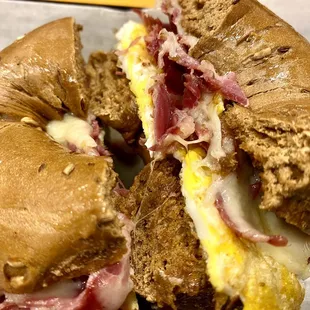 Egg, Swiss, and corned beef on a pumpernickel bagel.