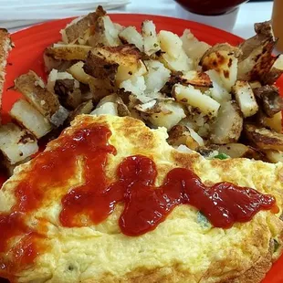 2/3 of a Yakatz omelet with home fries and wheat toast