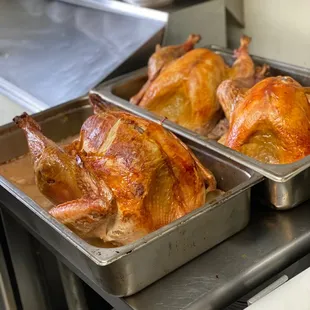 two pans of roasted chicken